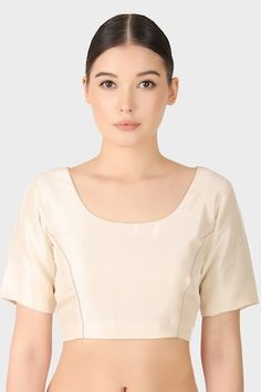 Ash ivory blouse in silk base with half sleeves. - Aza Fashions Beige Silk Tops For Wedding, Beige Silk Wedding Top, Beige Silk Top For Wedding, Elegant Beige Silk Blouse Piece, Fitted Elegant Beige Blouse Piece, Elegant Silk Blouse With Short Sleeves, White Padded Silk Blouse, White Silk Padded Blouse, Elegant Silk Short Sleeve Blouse Piece