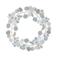 a wreath made out of leaves on a white background