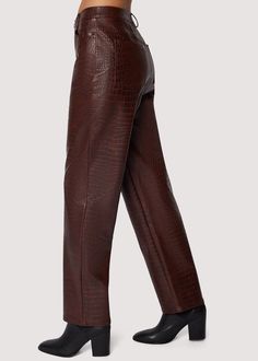 The Idalia Pants exude fall sophistication with it's faux croc leather texture, offering an elevated twist on a classic staple. Designed in a rich brown hue, these pants bring bold texture and sleek lines, making them the perfect statement piece for any fall wardrobe. Pair them with cozy knits or structured blazers to effortlessly channel a chic, polished look that turns heads all season long. WPWH04157 Imported Lined Self: 50% Cotton 50% PolyurethaneLining: 93% Polyester 7% Spandex Model is 5 f Skin Pattern, Croc Leather, Edgy Style, Crocodile Skin, Leather Texture, Swim Accessories, Cozy Knits, Short Rompers, Fall Wardrobe