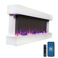 an electric fireplace with blue flames and remotes next to it on a white background