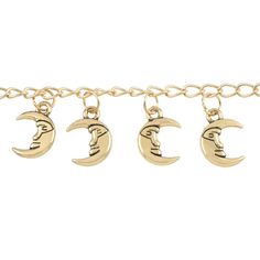 three gold bracelets with crescent moon and man's head charms on each side