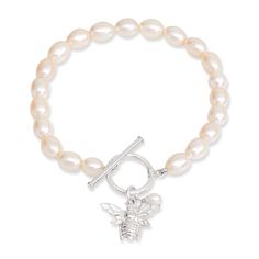 A gorgeous cultured freshwater pearl bracelet with sterling silver bumble bee charm which is seen as a symbol of celebration and community.    The perfect gift.  Matching necklace and earrings available. ﻿ Single strand oval cultured freshwater pearl bracelet with sterling silver toggle clasp & sterling silver bumble bee charm Pearls are quite soft and need special care after you wear them. Always store them in a separate jewellery pouch away from other jewellery and it is best to keep them in something soft.  From time to time, after you wear your pearls you should wipe them with a soft damp cloth to prevent dirt, chemicals and perspiration from diminishing the lustre of the pearls.  Always remember to take off your pearls when applying cosmetics, hairspray and perfume or when showering, Pearls Bracelet, Freshwater Pearl Jewelry, Freshwater Pearl Bracelet, Bee Charms, Freshwater Cultured Pearls, Back To Nature, Necklace And Earrings, Matching Necklaces, Toggle Clasp