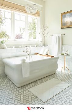 a white bath tub sitting next to a window