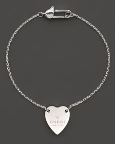 From the Trademark Collection, this sweet sterling silver bracelet features a woven chain with engraved logo heart charm. Designed by Gucci. Gucci Jewelry, Woven Chain, Buy Gucci, Bracelet Online, Engraved Logo, Heart Bracelet, Gold Pearl, Silver Bracelets, Sterling Silver Bracelets