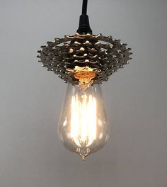 a light that is hanging from the ceiling with some sort of thing on it's side