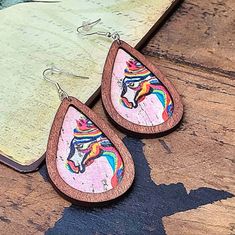 Stunning Western, Vintage Style Horse Head Earrings With Wood Grain Texture And Rainbow Coloring. Super Lightweight Wood Material. New! Pink Teardrop Earrings For Gift, Pink Teardrop Earrings Gift, Adjustable Pink Teardrop Earrings With Ear Wire, Handmade Adjustable Pink Teardrop Earrings, Pink Hypoallergenic Teardrop Earrings, Brown Southwestern Teardrop Jewelry, Brown Bohemian Hand Painted Earrings, Horse Hair Earrings, Rustic Brown Hand Tooled Earrings