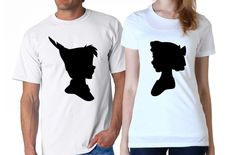 a man and woman wearing t - shirts with the silhouettes of two people on them