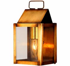 an old fashioned brass lantern with a light bulb on the front and side panels, isolated against a white background