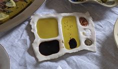 an assortment of condiments are displayed on a table