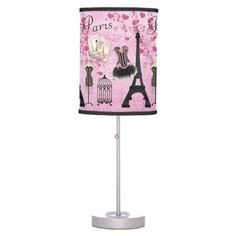 a pink lamp with the eiffel tower in paris on it's base