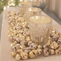 a table topped with glass cups and bells