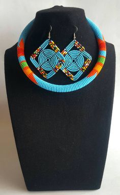 This listing is for a choker necklace with matching earrings. Sizes; 13 inches 14 inches 15 inches 16 inches. **Buy multiple items and pay shipping for 1 item only.The rest ships free. Thank you for visiting! More neckleces here; https://www.etsy.com/shop/TribalTess?ref=seller-platform-mcnav&section_id=21306083 Back to my shop; https://www.etsy.com/shop/TribalTess?ref=seller-platform-mcnav Masai Jewelry, African Bangles, Ankara Earrings, Necklaces Beautiful, African Necklace, Maasai, African Beads, Long Pendant Necklace, Large Hoop Earrings