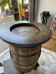 a barrel sitting on top of a metal stand