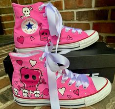 Custom painted Sneakers with Skulls and Bows on bubblegum pink converse shoes. I can do these in a number of color combinations and can tweek the design custom for you! What a FUNKY shoe! Complete with crystal bling! No Two shoes are ever alike. So your shoes will be OOAK to a T. The possibilities are endless! This listing is for children's sizes up to a 10.5-3 youth. I have them in infant and adult sizes as well in the chucks section of my shop. Check out more of my work in my shop: https://www Pink Hand Painted Casual Custom Sneakers, Casual Hand Painted Pink Custom Sneakers, Casual Pink Hand Painted Custom Sneakers, Pink Hand Painted Custom Sneakers For Streetwear, Cute High-top Custom Pink Sneakers, Pink Hand-painted Custom Sneakers For Streetwear, Cute Pink High-top Custom Sneakers, Pink Hand Painted Low-top Custom Sneakers, Hand Painted Pink Lace-up Custom Sneakers