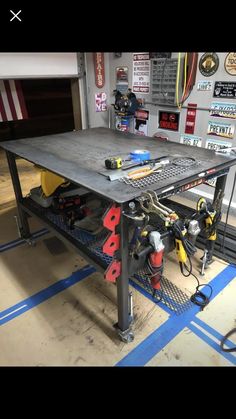 a workbench with tools on it in a garage