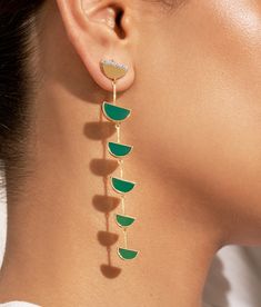 At the crossroads of old-fashioned style and inspirations from other horizons, Seema is a collection that shakes up the lines of femininity. Beyond its remarkable mix of gold and silver, it brings a graphic and modern twist by playing nicely with shapes and curves, all meticulously worked by hand.

 Light and elegant, the Seema earrings in Green Onyx will enhance your head posture. Hair tied up or down, they will dance with each of your outfits. The Crossroads, Onyx Earrings, Moon Shapes, Green Onyx, Half Moon, Gold And Silver, Ring Necklace, Hair Ties, Shop Earrings