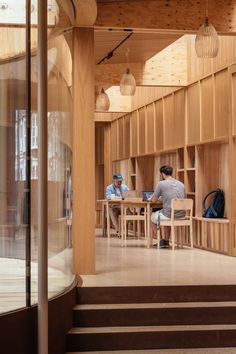 Frameless curved glass walls in timber structure