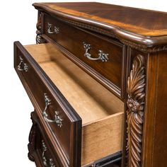 an ornate wooden dresser with drawers and handles