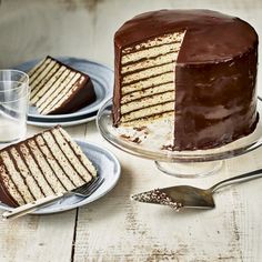 there is a cake that has been cut and served on the table with two plates