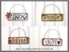 four different signs hanging from the side of a white door with snowflakes on them