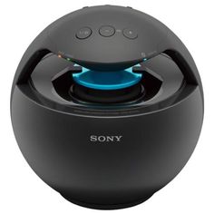 the sony speaker is sitting on top of a black object with blue light coming from it