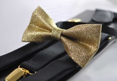 Welcome to OsunWorld! Item: Gold shining Bow tie and   Matched Elastic Adjustable Suspenders            Condition: Brand New Color: Gold Shining Bow tie              and BLACK Please be aware the color is quite close and matched, but not 100% the same.  Material: Bow Tie-Faux Leather Suspenders-Elastic    Bow tie Fits 0-12 months:width 4.5cm*Length 8cm 【Adjustable strap】    Bow tie Fits 1-6 Years Old: width 5cm*Length 9cm 【Adjustable strap】    Bow Tie Fits 7-14 Years Old width 5.5cm* Length 10.5 Party Suit And Tie Accessories With Adjustable Ties, Gold Adjustable Suit And Tie Accessories For Party, Adjustable Dapper Belts And Suspenders For Party, Adjustable Party Ties For Father's Day, Elegant Adjustable Gold Belts And Suspenders, Black Suit With Gold Bow Tie And Suspenders, Bow Tie And Suspenders Set For Father's Day Party, Gold Bow Ties For Wedding, Gold Bow Tie Accessories For Wedding