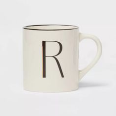 a white coffee mug with the letter r on it