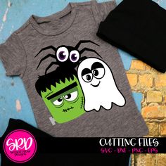 two children's t - shirts with cartoon characters on them, one is grey and the other is black