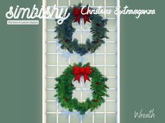 two christmas wreaths hanging on a wall