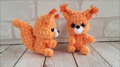 two small stuffed animals sitting next to each other