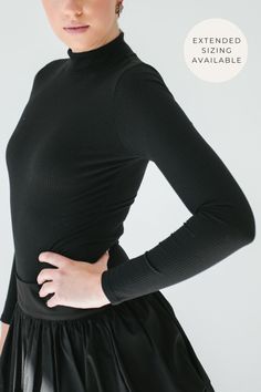 STYLE + FIT NOTES: This All You Need Ribbed Bodysuit is a must-have all year long! Ribbed knit material pairs perfectly with every outfit to keep you looking classy + chic! Take your true size for the perfect fit. Black Stretch Bodysuit For Layering, Classic Black Stretch Bodysuit, Fitted Black Bodysuit For Layering, Black Fitted Bodysuit For Layering, Chic Stretch Bodysuit For Layering, Black Long Sleeve Ribbed Bodysuit, Winter Workwear Stretch Bodysuit, Black Stretch Bodysuit For Winter, Black Ribbed High Stretch Bodysuit