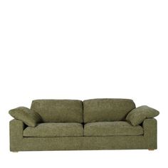 a green couch against a white background