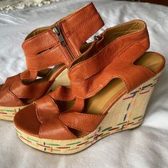 Nine West Vatheonlyone Orange Leather And Multi-Color Wedge, Size 9 * Never Worn * Good Condition, See Photos * Smoke-Free/Pet-Free Home * These Are Super Cute And Comfortable Wedges! Perfect For Summer Or Vacation, And Definitely A Chic, Bold Choice To Add To An Outfit. Additional Details: Leather Upper Balance Man Made Zipper Closure Woven, Multi-Colored Wedge Please Let Me Know If You Have Any Questions! Orange Leather Wedge Heels, Orange Leather Platform Wedge Sandals, Orange Leather Wedge Heel Sandals, Casual Orange Synthetic Wedge Sandals, Casual Orange Closed Toe Wedge Sandals, Orange Wedge Sandals With Removable Insole, Brown Wedge Sandals With Cushioned Footbed, Casual Orange Platform Wedge Sandals, Closure Weave