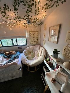 the bedroom is decorated in white and has lots of plants on the ceiling above it