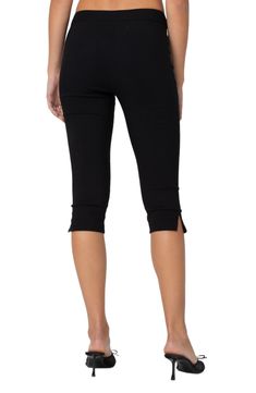 Stretchy capri pants bring a chic look and ultracomfort to every ensemble. Zip fly with hook-and-bar closure 45% cotton, 45% polyester, 10% spandex Machine wash, dry flat Imported Black Cropped Leg Capris With Pockets, Versatile Black Capri Bottoms, Versatile Black Capri-length Bottoms, Versatile Black Capris For Spring, Versatile Black Spring Capris, Black Cotton Capris For Work, Casual Black Short Length Capris, Stretch Cotton Capris For Work, Black Knee-length Capris For Summer