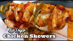 chicken skewers on a plate with the words air fryer chicken skewers