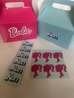 three boxes with different designs on them sitting next to each other and one box has the word barbie written on it