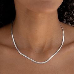 This stunning silver statement necklace boasts a sleek flat snake chain design that adds a touch of modern elegance to any outfit, whether worn alone or layered. The necklace is crafted in sterling silver.


Snake chain has a width of 2.9mm

Necklace has an adjustable length and can be set between 16” to 18” long Flat Silver Necklace, Silver Aesthetic Rings, Snake Chain Necklace Silver, Silver Necklaces Aesthetic, Outfit Bord, Silver Necklace Aesthetic, Necklace Layering Silver, Silver Chains For Women, Farewell Dance