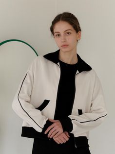 This is YUPPE’s zip-up jacket features contrasting accents for added flair. The main fabric has a subtle sheen with a jersey-like texture. Contrast stitching runs along the shoulder line to the end of the sleeves, providing extra detail. With its basic design, it complements various looks effortlessly.- It's a great item for daily wear- You can mix and match it with different bottoms to create various styles- The elastic bands at the hem and sleeve cuffs offer comfort and flexibility- A logo embroidery on the back neck adds a distinctive touch- With its pockets, it's a versatile zip-up jacket for everyday use White Track Jacket With Contrast Color For Fall, Sporty Half-zip Track Jacket With Zipper Closure, Sporty Half-zip Track Jacket With Zipper, Modern Track Jacket With Zipper For Streetwear, Fall Track Jacket With Contrast Panels And Long Sleeves, Fall Half-zip Track Jacket With Zipper Closure, Fall Half-zip Track Jacket With Zipper, White Winter Track Jacket With Contrast Panels, White Track Jacket With Zipper Closure For Fall