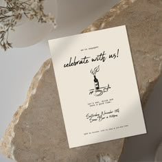 an image of a birthday party card on a rock