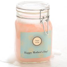 a jar filled with pink liquid sitting on top of a white table next to a tag