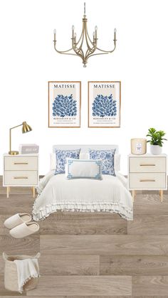 a white bedroom with blue and white decor on the walls, wood flooring and chandelier