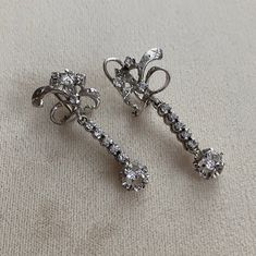 These are beautiful Mid Century 10k white gold, tested, unmarked earrings with prong set Clear Spinels. These are so beautiful on and have lots of movement and sparkle. All gems are tested with a presidium gem tester. 1.5" L 2.8g each Shipments are made on Wednesdays*  Please ask if you need it shipped sooner. Will only ship to Etsy listed address. Sorry, I do NOT ship International. All sales are final, please message me for more photos or information Vintage Diamond Clip-on Earrings, White Gold Sterling Silver Clip-on Diamond Earrings, White Gold Clip-on Diamond Earrings In Sterling Silver, Vintage Clip-on Diamond Earrings For Anniversary, Vintage Platinum Earrings, Vintage Silver Diamond Earrings In Platinum, Vintage Platinum Diamond Earrings In Silver, Silver Platinum Earrings With 17 Jewels, Silver Diamond Clip-on Earrings