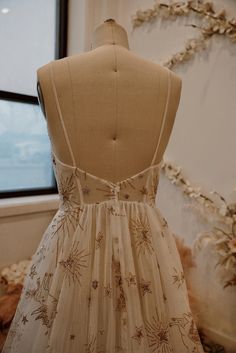 a dress on display in front of a window