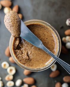 a jar filled with peanut butter and topped with a spoon