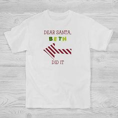 a white t - shirt with the words dear santa, beh did it on it