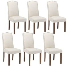 six white dining chairs with wooden legs and nail polishing on the backrests