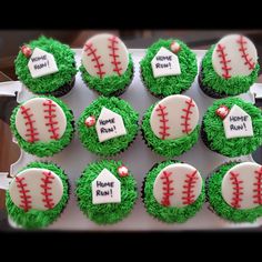 cupcakes decorated with green frosting and baseball decorations