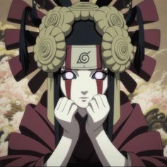 an anime character with her hands on her face and eyes closed, looking at the camera