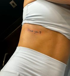 a woman's stomach with the words i love you written on it